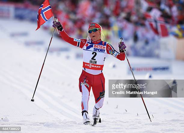 Therese Johaug of Norway crosses the finish line to win the gold medal in the Women's 30km Mass Start Cross-Country during the FIS Nordic World Ski...