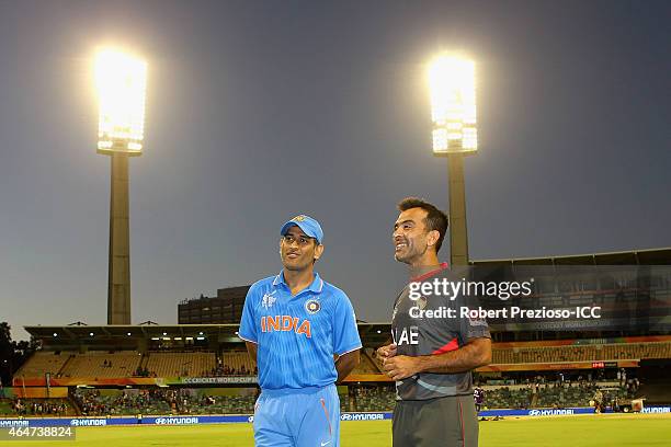 Dhoni of India and Mohamed Tauqir of UAE look on during the 2015 ICC Cricket World Cup match between India and the United Arab Emirates at WACA on...