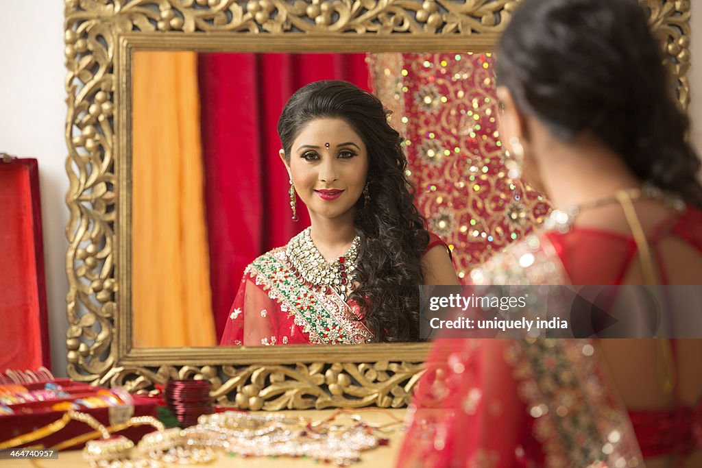 Reflection of a bridal woman in mirror