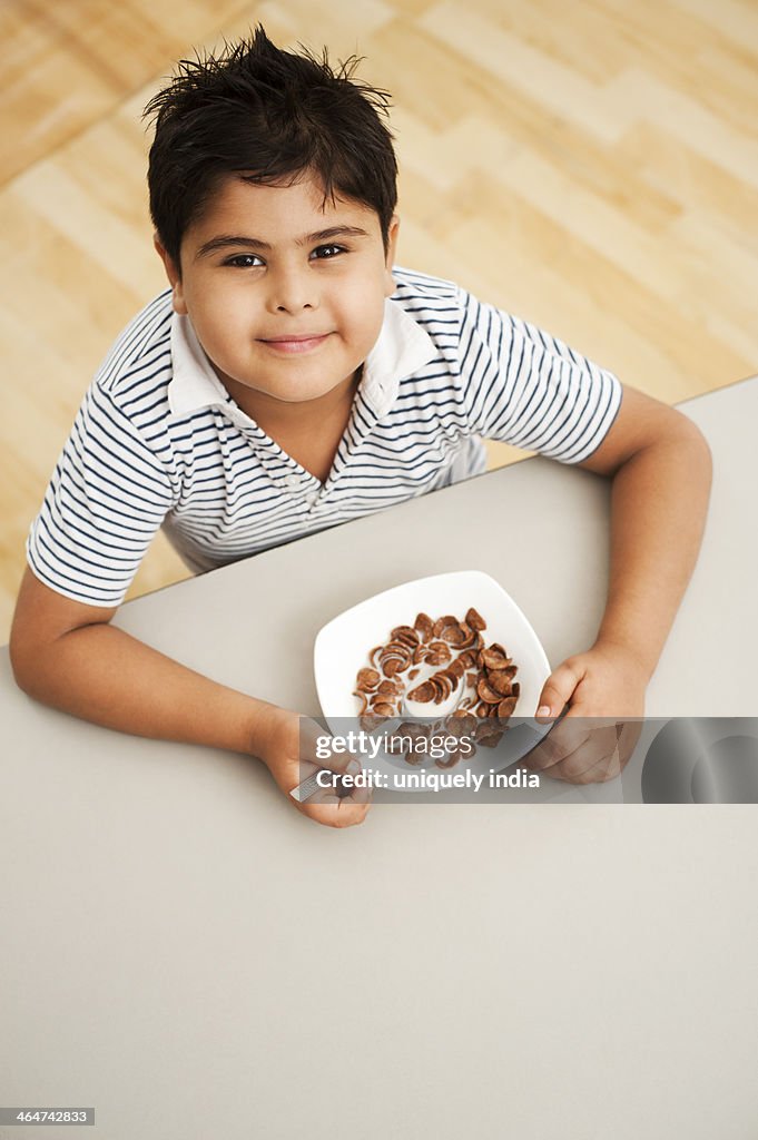 Boy eating chocolate corn flakes