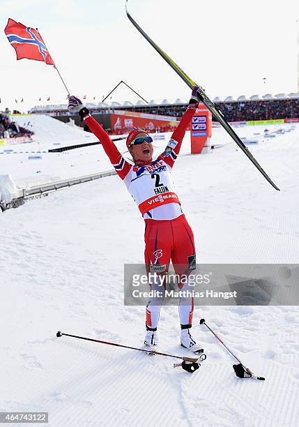 Therese Johaug of Norway celebrates winning the gold medal in the Women's 30km Mass Start Cross-Country during the FIS Nordic World Ski Championships...
