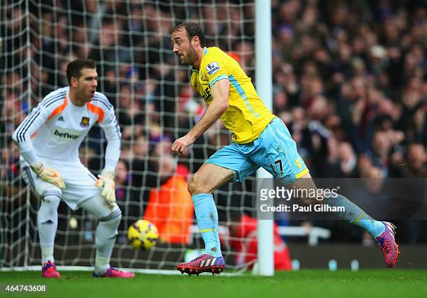 Despair for Adrian of West Ham United as Glenn Murray of Crystal Palace celebrates as he scores their third goal during the Barclays Premier League...