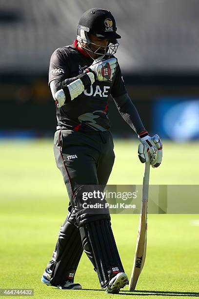 Khurram Khan of the UAE walks from the field after being dismissed during the 2015 ICC Cricket World Cup match between India and the United Arab...