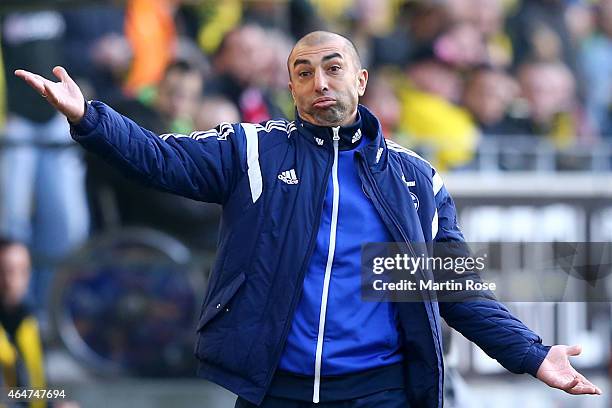 Roberto Di Matteo, head coach of Schalke gives instructions to his players during the Bundesliga match between Borussia Dortmund and FC Schalke 04 at...