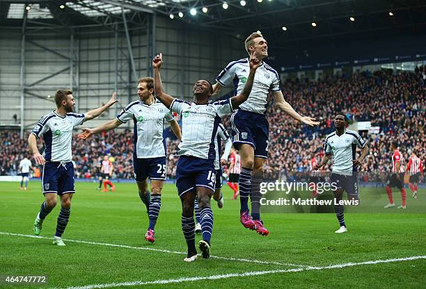 Saido Berahino of West Bromwich Albion celebrates with Darren Fletcher and team mates as he scores their first goal during the Barclays Premier...