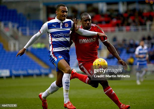Michail Antonio of Nottingham Forest and Michael Hector of Reading battle for the ball during the Sky Bet Championship match between Reading and...