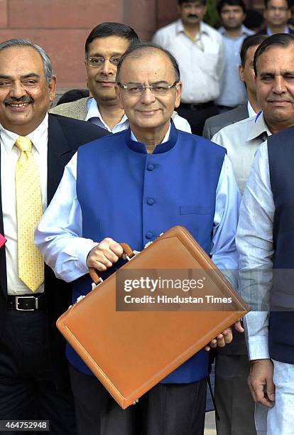 Finance Minister Arun Jaitley holding budget papers and his MOS Jyant Sinha with finance secretaries leaving his office for the Parliament to present...