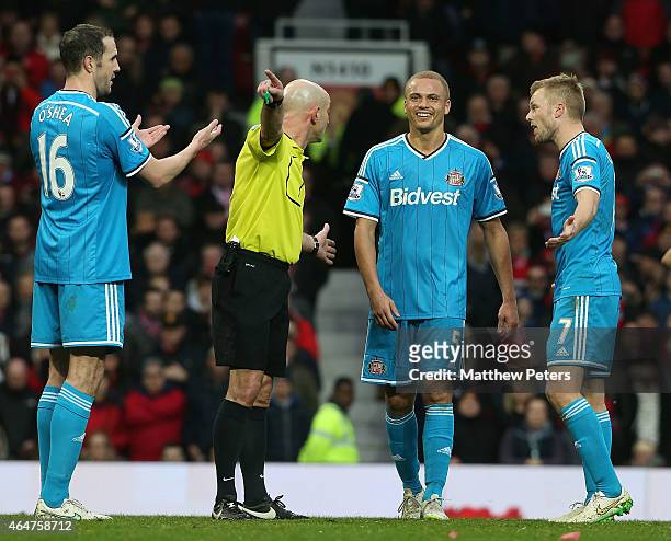 Wes Brown of Sunderland is sent off by Referee Roger East during the Barclays Premier League match between Manchester United and Sunderland at Old...