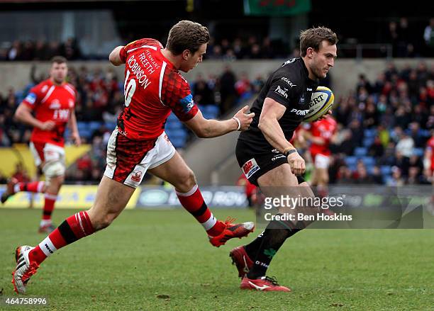 Andrew Fenby of London Irish breaks clear from Will Robinson of London Welsh to score a try during the Aviva Premiership match between London Welsh...