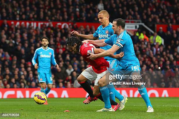 Radamel Falcao García of Manchester United is brought down in the area by Wes Brown and John O'Shea of Sunderland to win a penalty during the...