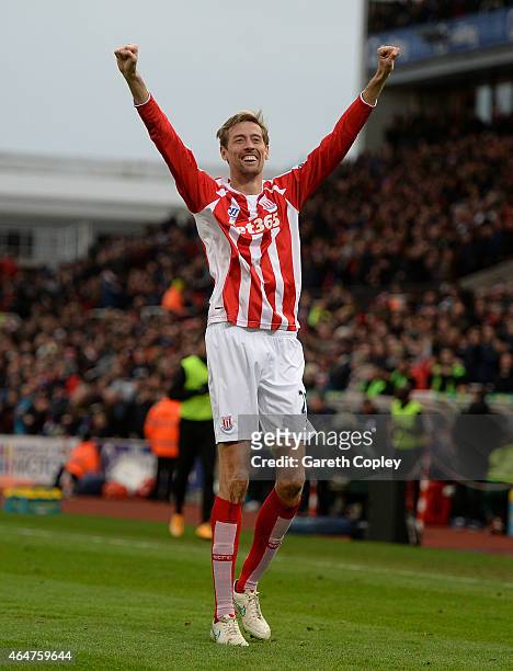 Peter Crouch of Stoke City celebrates scoring the first goal during the Barclays Premier League match between Stoke City and Hull City at Britannia...