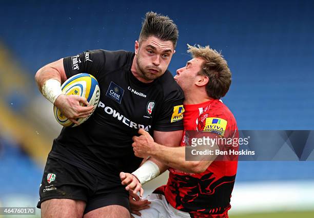 Eamonn Sheridan of London Irish is tackled by Will Robinson of London Welsh during the Aviva Premiership match between London Welsh and London Irish...