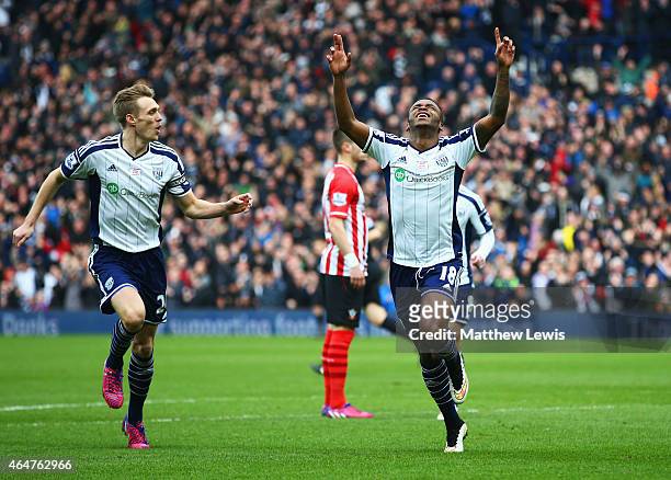 Saido Berahino of West Bromwich Albion celebrates with Darren Fletcher as he scores their first goal during the Barclays Premier League match between...