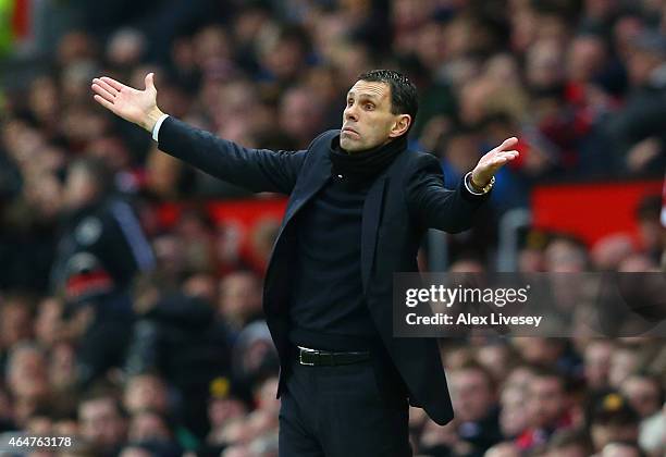 Manager Gustavo Poyet of Sunderland reacts uring the Barclays Premier League match between Manchester United and Sunderland at Old Trafford on...