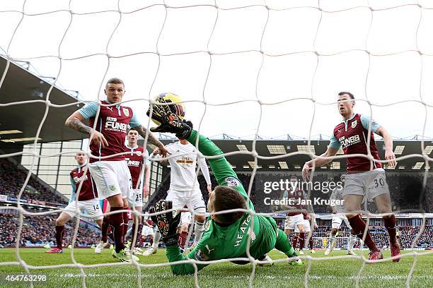 Kieran Trippier of Burnley scores an own goal past goalkeeper Thomas Heaton of Burnley during the Barclays Premier League match between Burnley and...