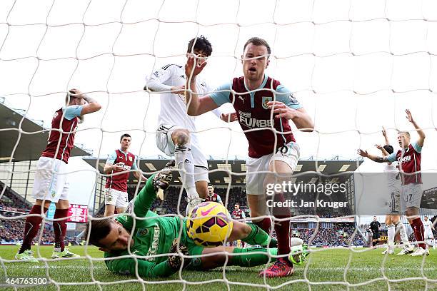 Kieran Trippier of Burnley scores an own goal past goalkeeper Thomas Heaton of Burnley during the Barclays Premier League match between Burnley and...