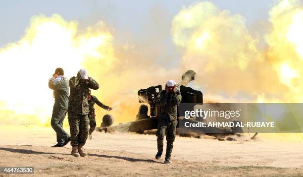 Volunteer Shiite fighters, known as the Popular Mobilisation units, who support the Iraqi government forces in the combat against the Islamic State...