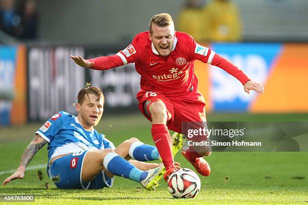 Daniel Brosinski of Mainz is challenged by Eugen Polanski of Hoffenheim during the Bundesliga match between 1899 Hoffenheim and 1. FSV Mainz 05 at...