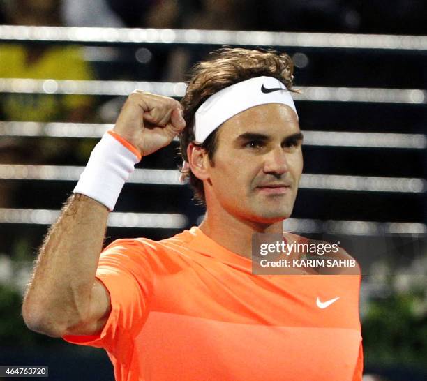 Roger Federer of Switzerland gestures to the crowd after defeating World number one Novak Djokovic of Serbia during their final match on the fifth...