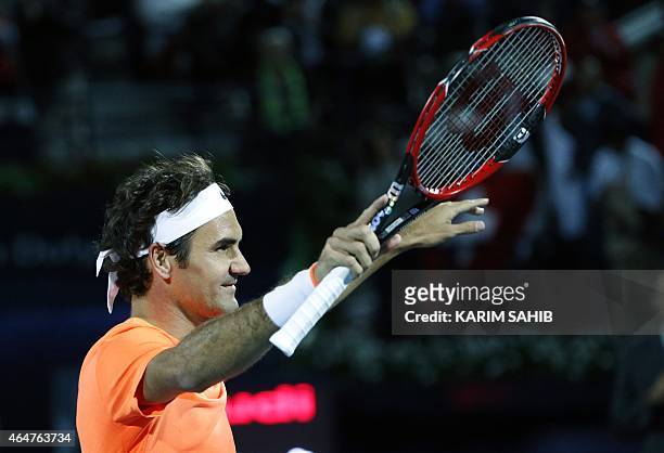 Roger Federer of Switzerland gestures to the crowd after defeating World number one Novak Djokovic of Serbia during their final match on the fifth...