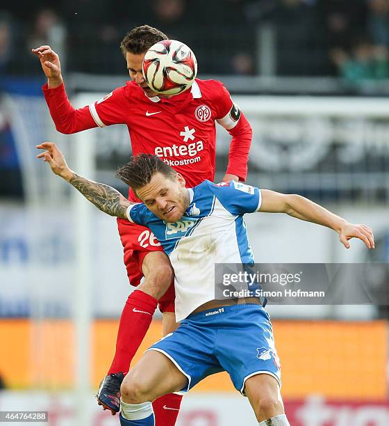 Niko Bungert of Mainz is challenged by Eugen Polanski of Hoffenheim during the Bundesliga match between 1899 Hoffenheim and 1. FSV Mainz 05 at Wirsol...