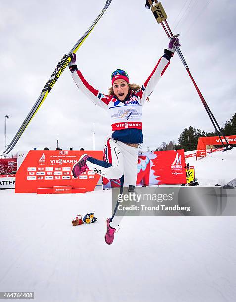 Therese Johaug of Norway celebrates winning the gold medal during the Ladies 30.0 km Mass Start Classic during the FIS Nordic World Ski Championships...