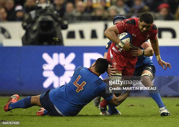 France's lock Romain Taofifenua tackles Wales' number eight Taulupe Faletau during the Six Nations international rugby union match between France and...