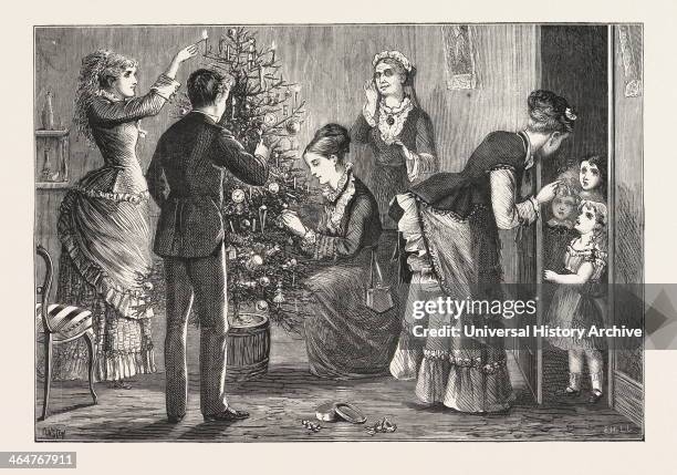 Dressing The Christmas Tree: The Finishing Touch: May I Come In? Engraving 1876.