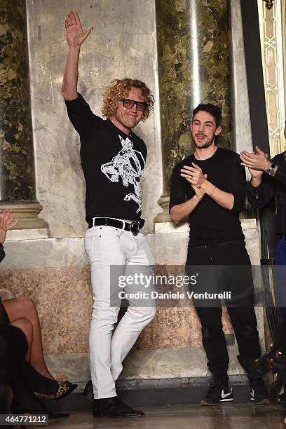 Emilio Pucci designer Peter Dundas acknowledges the applause of the public after the Emilio Pucci show during the Milan Fashion Week Fall/Winter 2015...