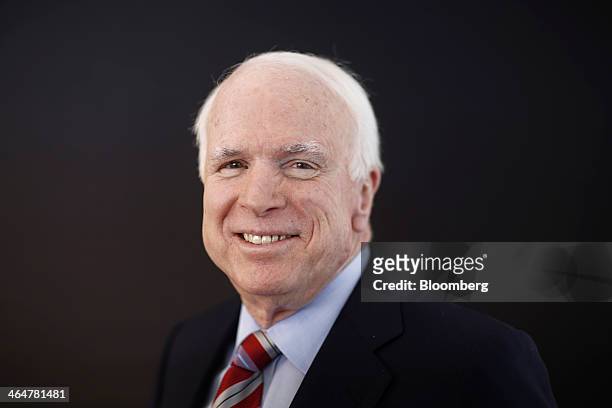 Senator John McCain, a Republican from Arizona, poses for a photograph following a Bloomberg Television interview on day two of the World Economic...