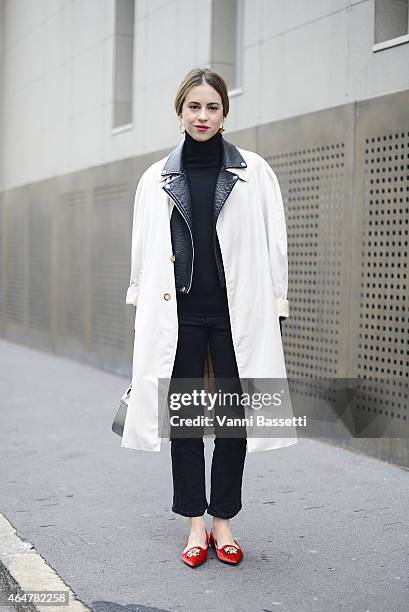 Saray Martin poses wearing a Burberry trench, Zara jacket and Loewe bag on February 28, 2015 in Milan, Italy.