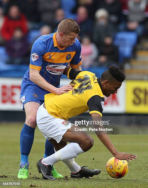 Ivan Toney of Northampton Town attempts to control the ball under pressure from Keith Southern of Shrewsbury Town during the Sky Bet League Two match...