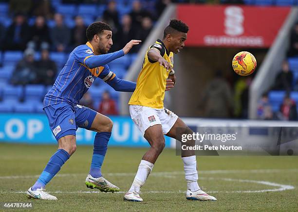 Ivan Toney of Northampton Town attempts to control the ball under pressure from Connor Goldson of Shrewsbury Town during the Sky Bet League Two match...