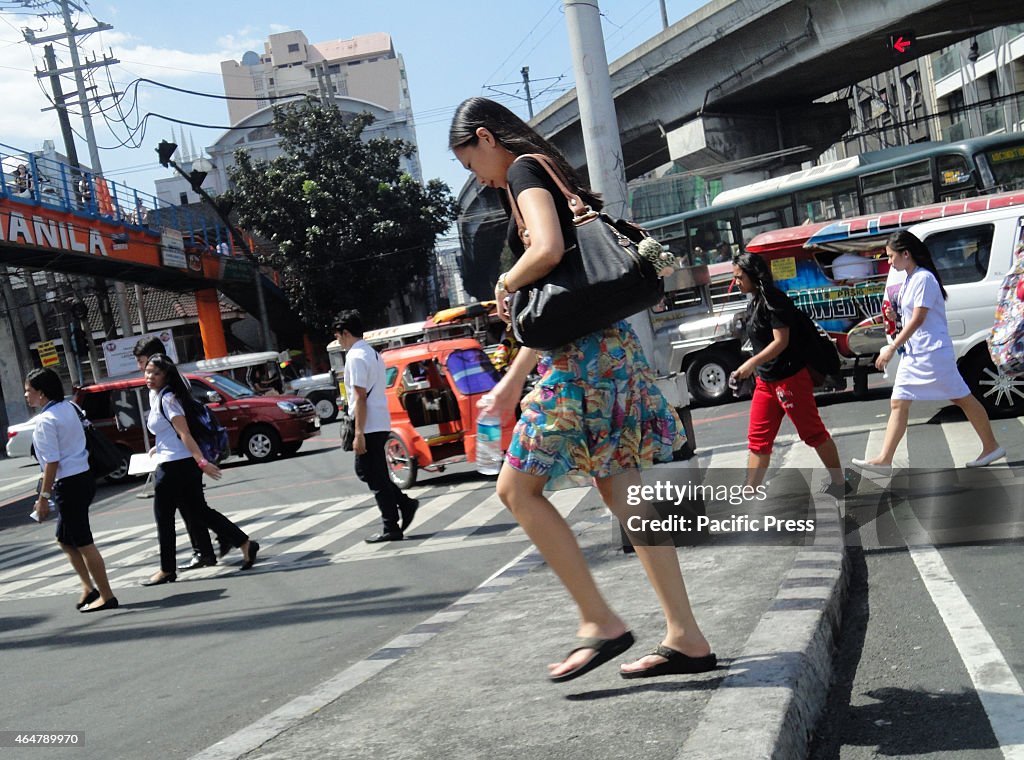 Students from nearby campuses cross the historic Mendiola...