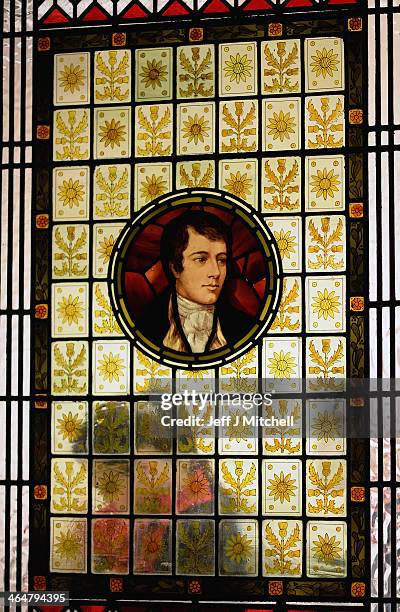 People enjoy a Burns supper in the red room at Burns Cottage Pavilion on January 23, 2014 in Alloway, Scotland. People around the world will mark the...