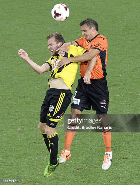 Jade North of the Roar and Jeremy Brockie of the Phoenix challenge for the ball during the round 16 A-League match between Brisbane Roar and the...