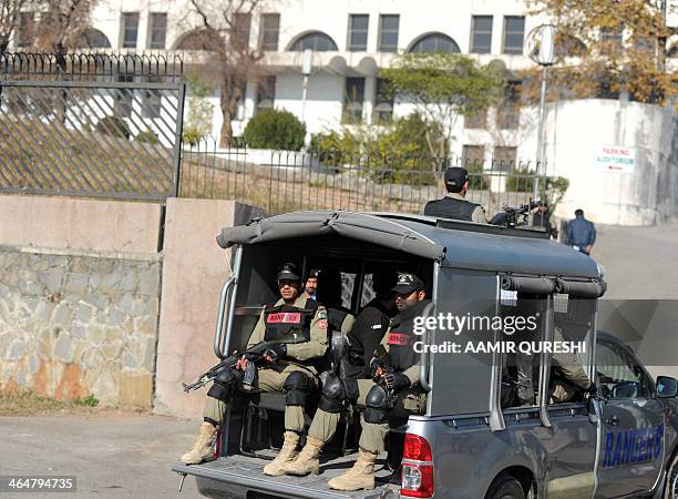 Pakistani paramilitary soldiers enter at a special court premises set up to try former Pakistani military ruler Pervez Musharraf in Islamabad on...