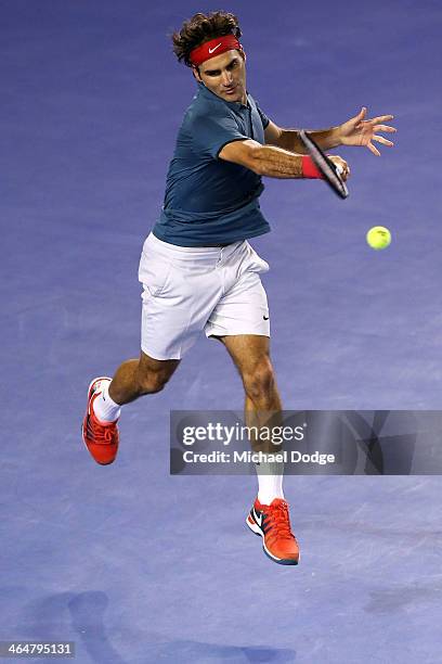 Roger Federer of Switzerland plays a forehand in his semifinal match against Rafael Nadal of Spain during day 12 of the 2014 Australian Open at...