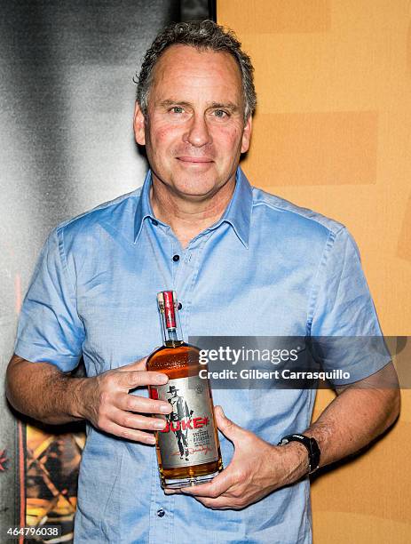 Actor Ethan Wayne, son of actor John Wayne, signs bottles of Duke Bourbon during 186th PHS Philadelphia Flower Show, "Celebrate the Movies", at...