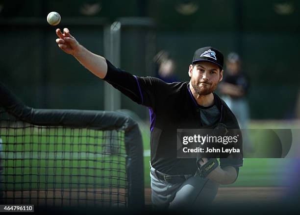 Colorado Rockies Adam Ottavino delivers a pitch during the teams workout on day 8 of spring training February 28, 2015 in Scottsdale.