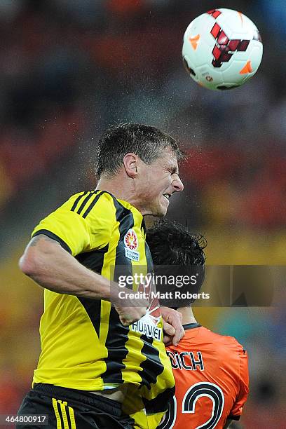 Benjamin Sigmund of the Phoenix heads the ball over Thomas Broich of the Roar during the round 16 A-League match between Brisbane Roar and the...