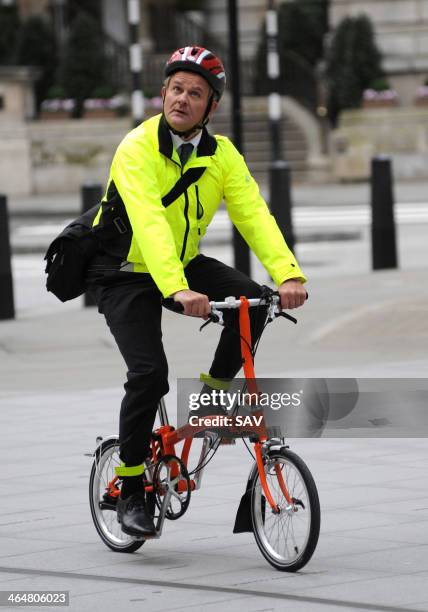 Hugh Bonneville pictured being filmed whilst cycling outside the BBC on January 24, 2014 in London, England.