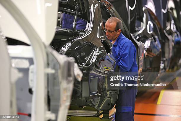 Workers assemble S-Class sedans on the assembly line at the Mercedes-Benz plant of Daimler AG on January 24, 2014 in Sindelfingen, Germany. Daimler...