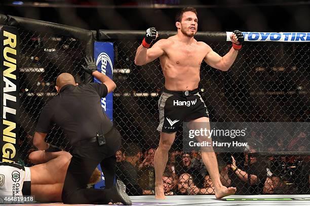 Jake Ellenberger celebrates his submission victory over Josh Koscheck in their welterweight bout during the UFC 184 event at Staples Center on...