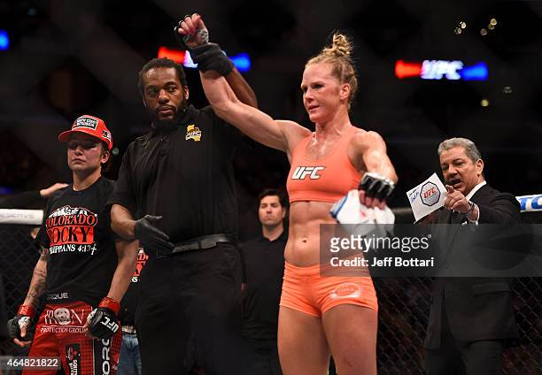 Holly Holm celebrates her win over Raquel Pennington after their women's bantamweight bout during the UFC 184 event at Staples Center on February 28,...