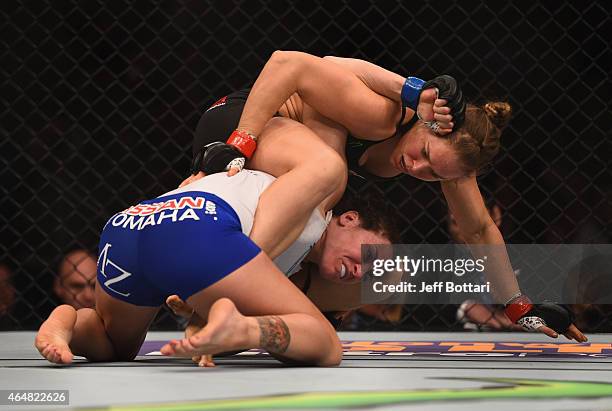 Ronda Rousey grapples with Cat Zingano in their UFC women's bantamweight championship bout during the UFC 184 event at Staples Center on February 28,...