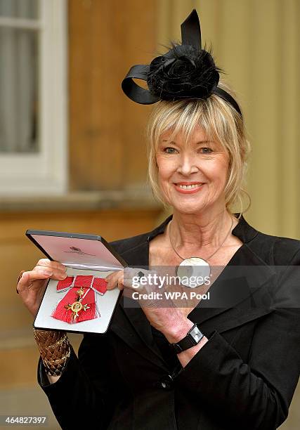 News presenter Julia Somerville holds her OBE presented to her by the Prince of Wales during an investiture ceremony at Buckingham Palace on January...