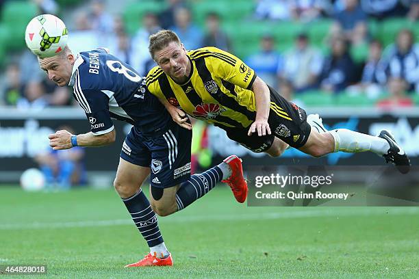 Besart Berisha of the Victory and Benjamin Sigmund of the Phoenix contest to head the ball during the round 19 A-League match between the Melbourne...