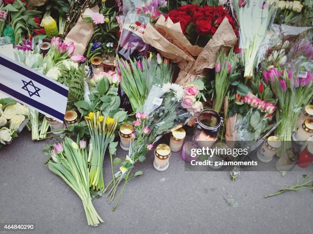 flowers in front of synagogue in copenhagen - terrorism stock pictures, royalty-free photos & images
