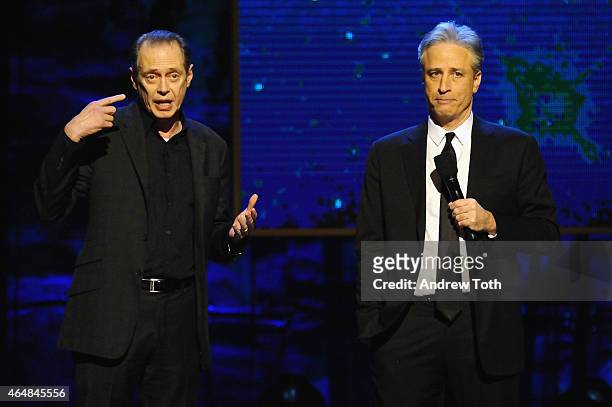 Steve Buscemi and Jon Stewart perform on stage at Comedy Central's 'Night of Too Many Stars: America Comes Together For Autism Programs' on February...